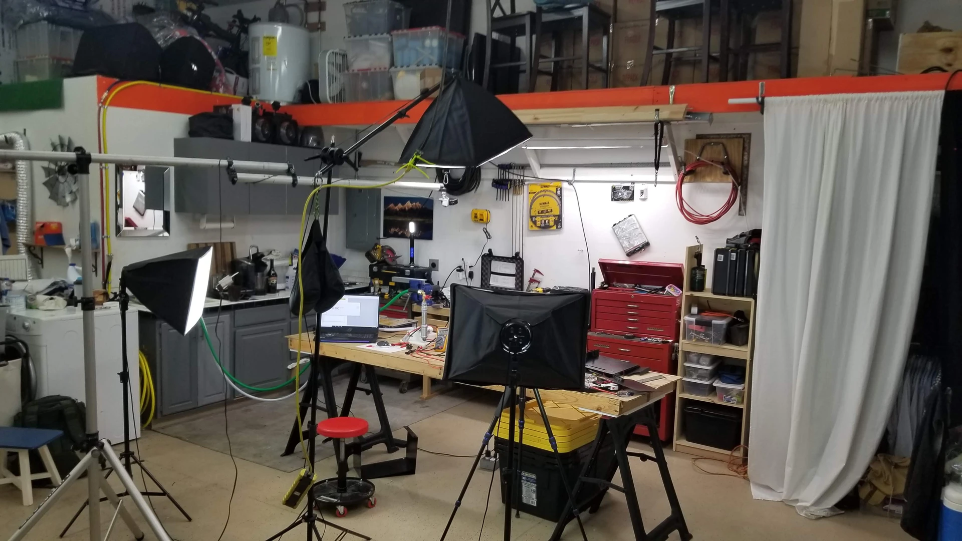 Our messy Idaho shop set up with video equipment for testing battery cells
