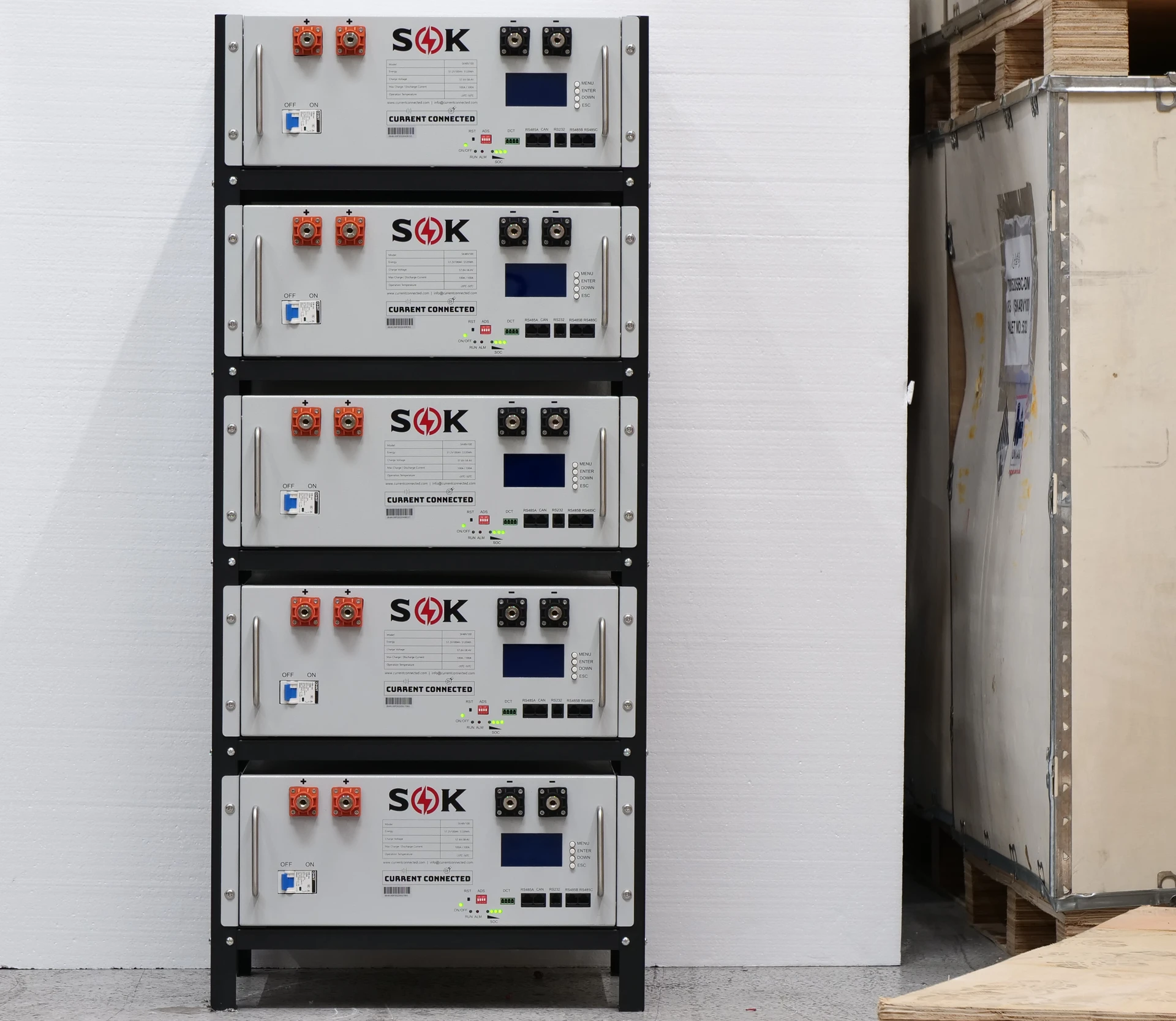 Photo of batteries set up in a shop or garage. 