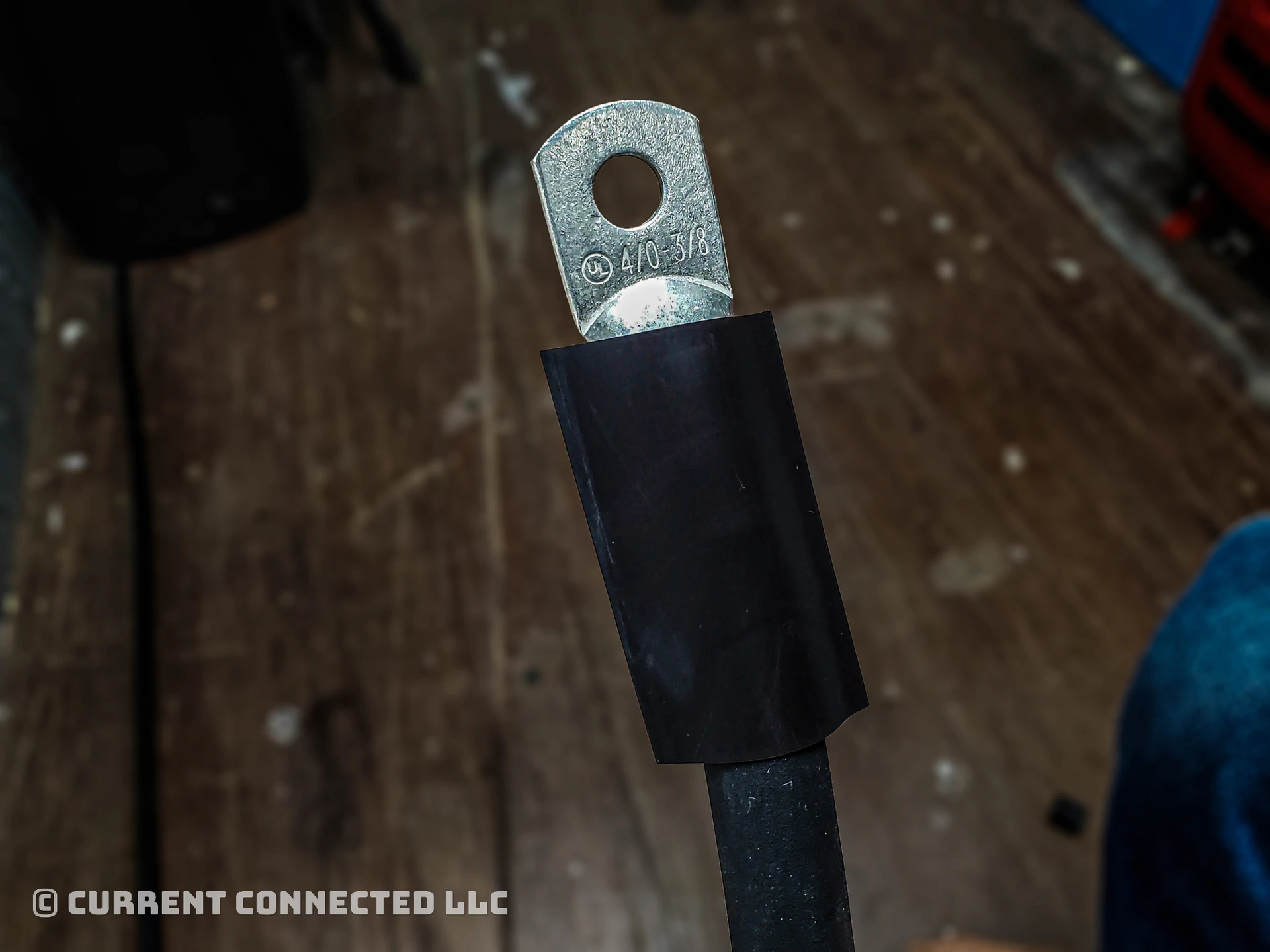Photo of lug with heat shrink over it. 