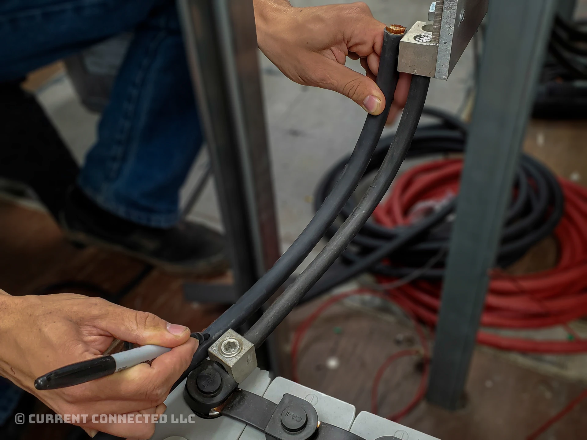 Photo of someone measuring the cable length. 
