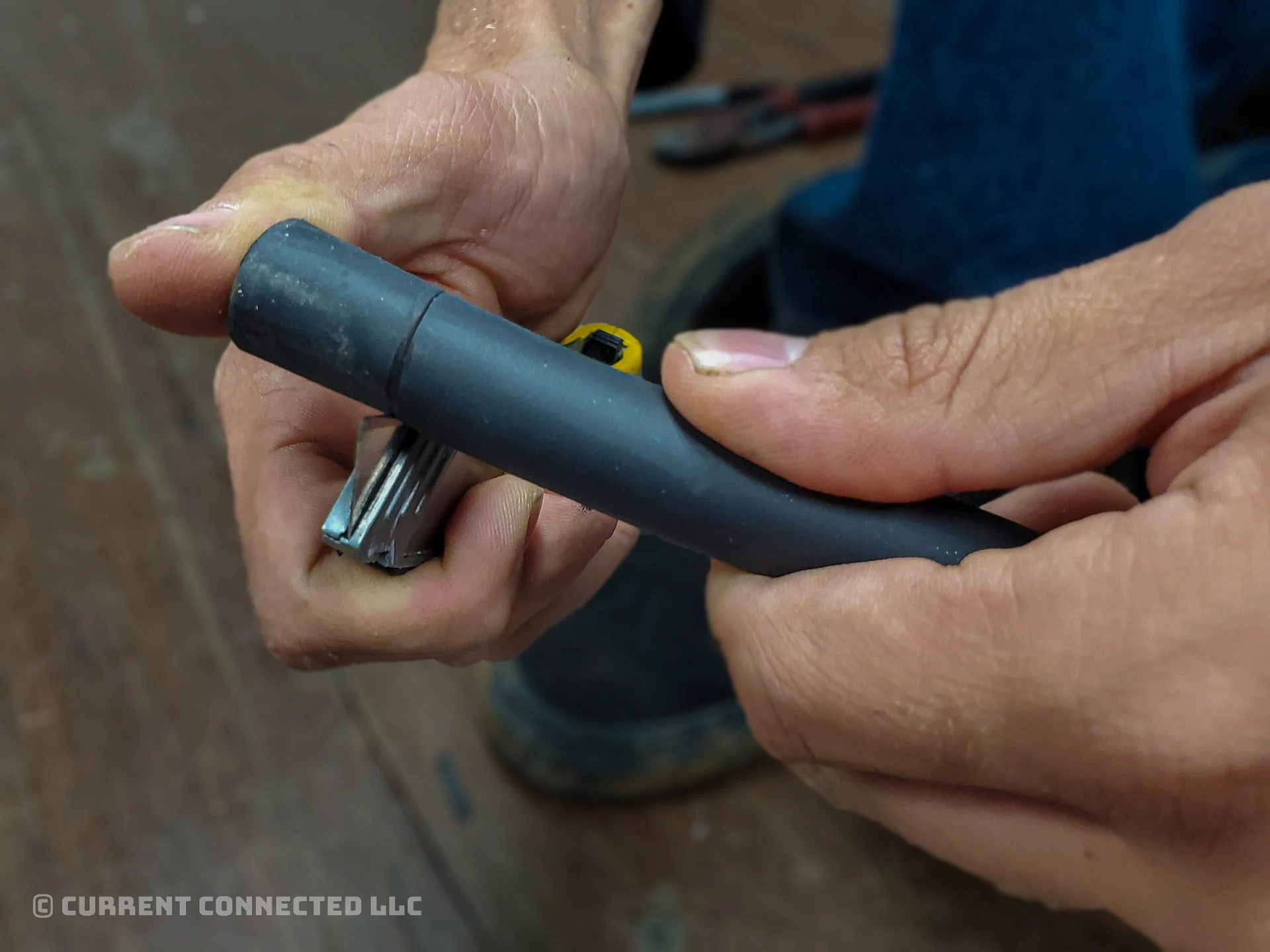Photo of someone cutting the insulation for stripping.
